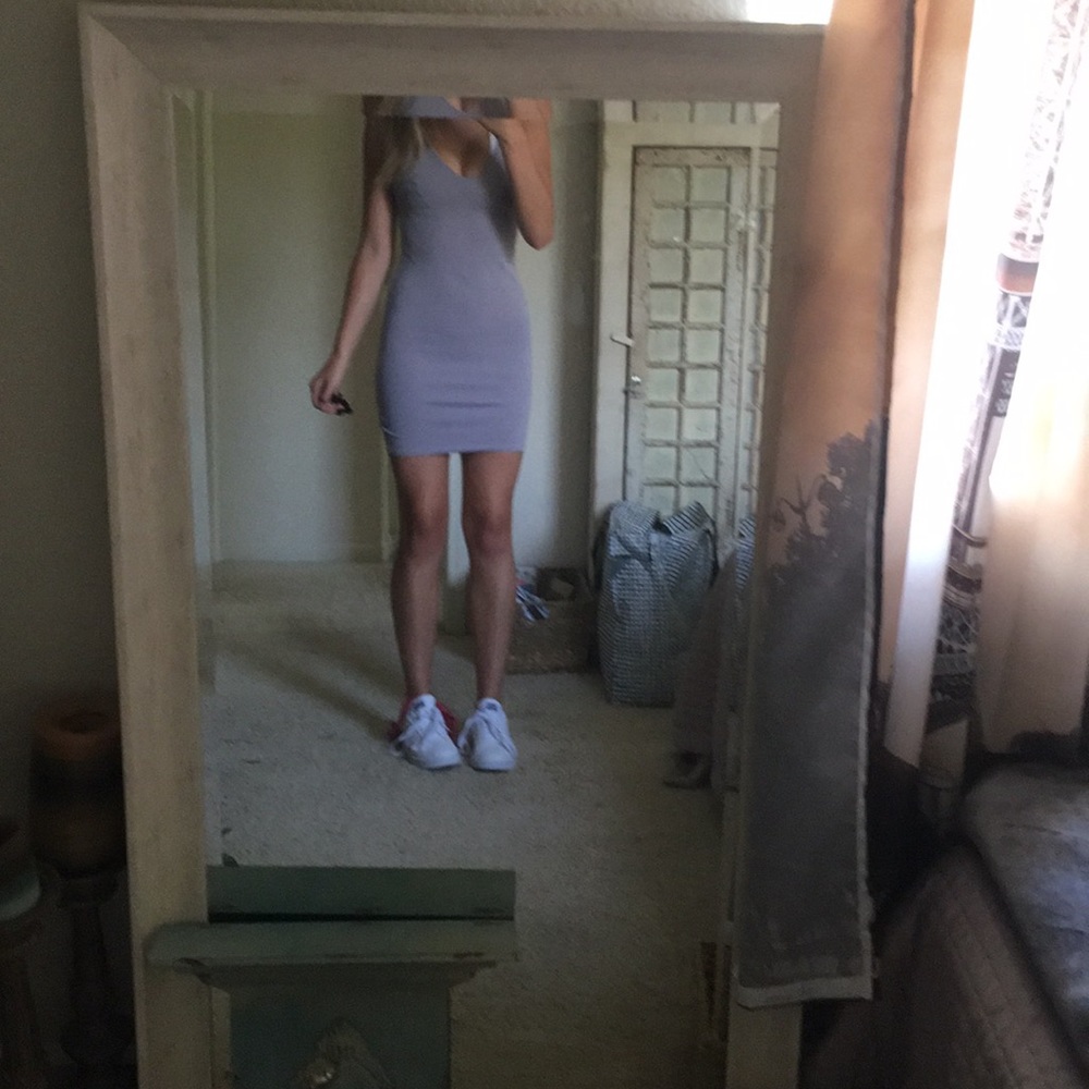 Tight lavender semi-formal dress, with open back